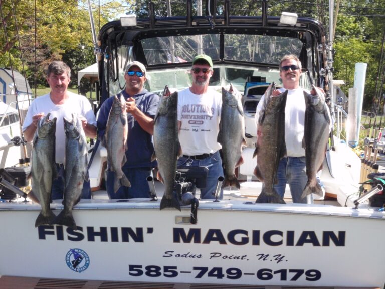4 anglers on a charter boat with their impressive king salmon make the case to keep lake fishing in the fall.