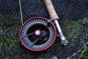 A close-up of a Greys fly reel.