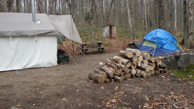 A large campsite in the woods. 