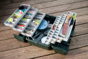 A tacklebox filled with a variety of lures. 
