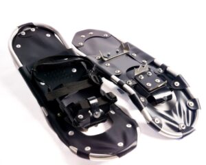 Ice spike attachments for the bottom of snow boots, designed for assisting anglers when fishing in winter.