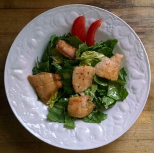 A salad that includes panfish. 