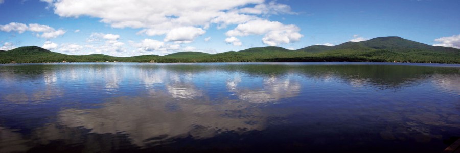 A large lake with mountains in the background.