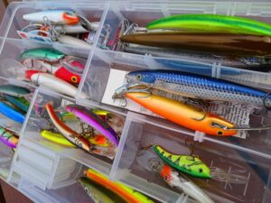A close up of a box of fishing lures.