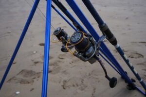 Two large Shimano bait reels set up with braided line. 