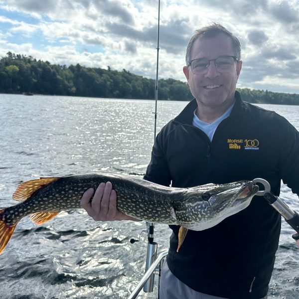 Brian holding a northern pike caught while trolling on Lake Champlain